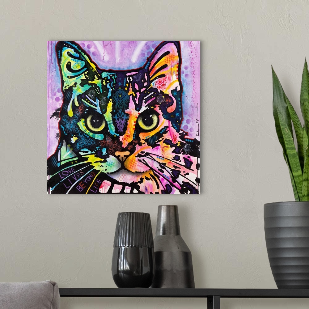 A modern room featuring Square art with an illustration of a cat with colorful abstract markings on a purple background.