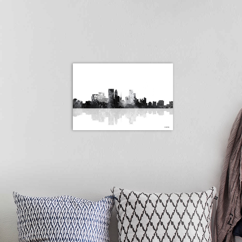 A bohemian room featuring Contemporary black and white watercolor skyline casting a mirror-like reflection below.