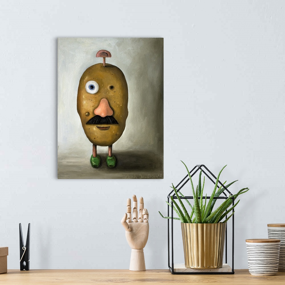 A bohemian room featuring Surrealist painting of a potato head toy with one eye missing and one ear on the top of the head.