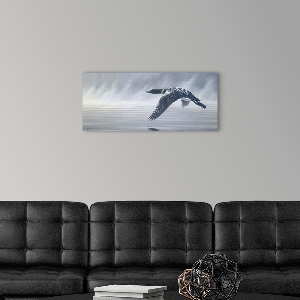 A modern room featuring Loon flying over misty water.