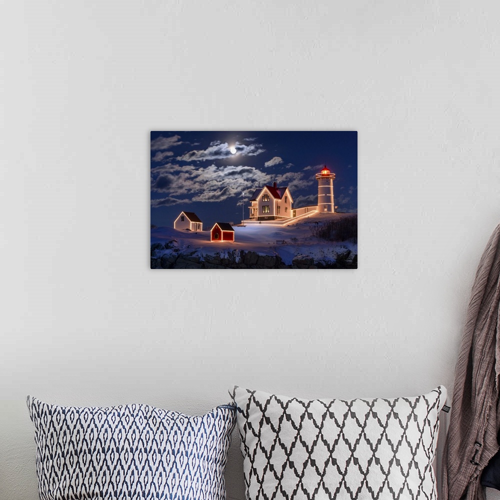 A bohemian room featuring Photograph of a lighthouse and other small building outlined in lights, under a bright moon and c...