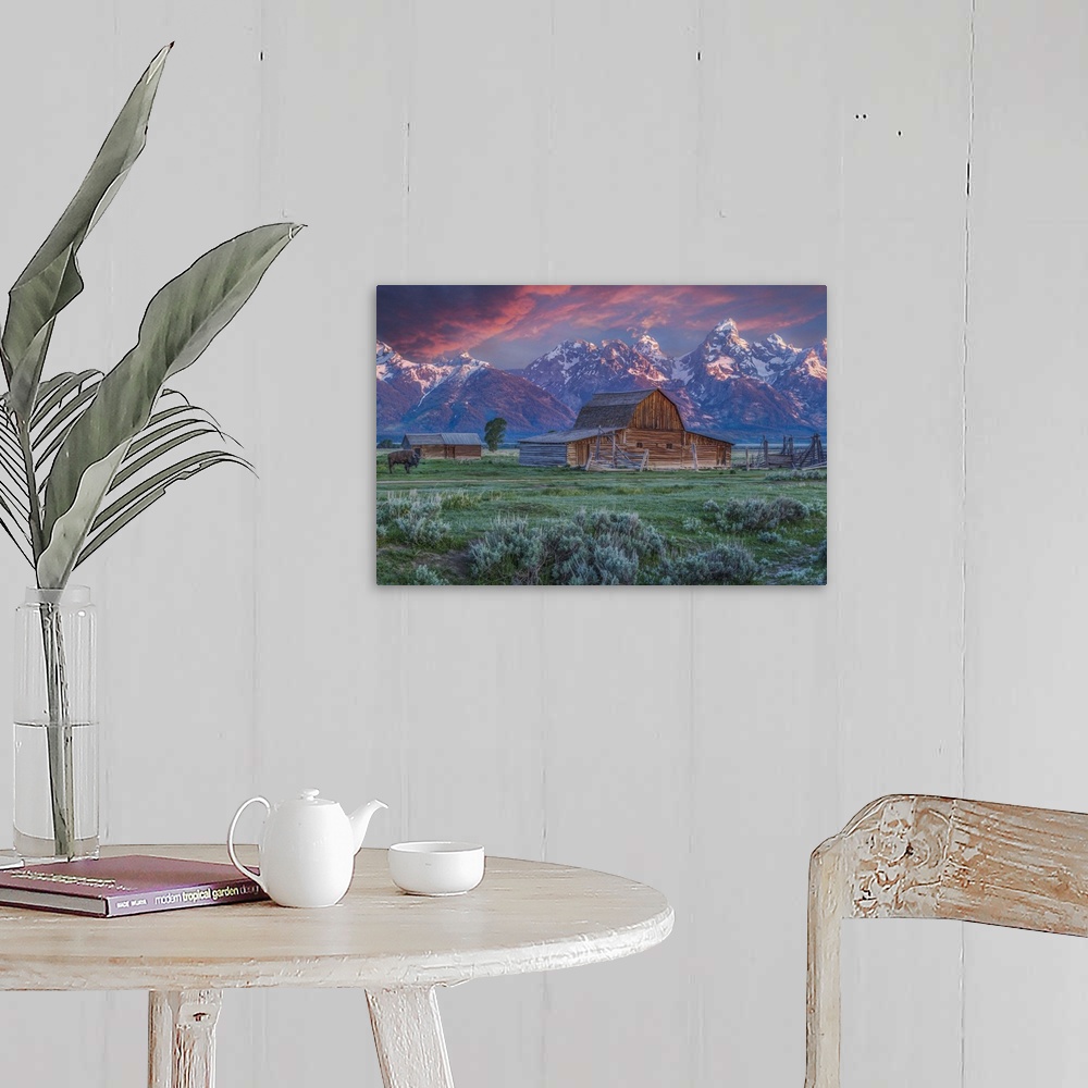 A farmhouse room featuring A photograph of the Mormon Row Barn in Wyoming, with the Teton mountains in the background.