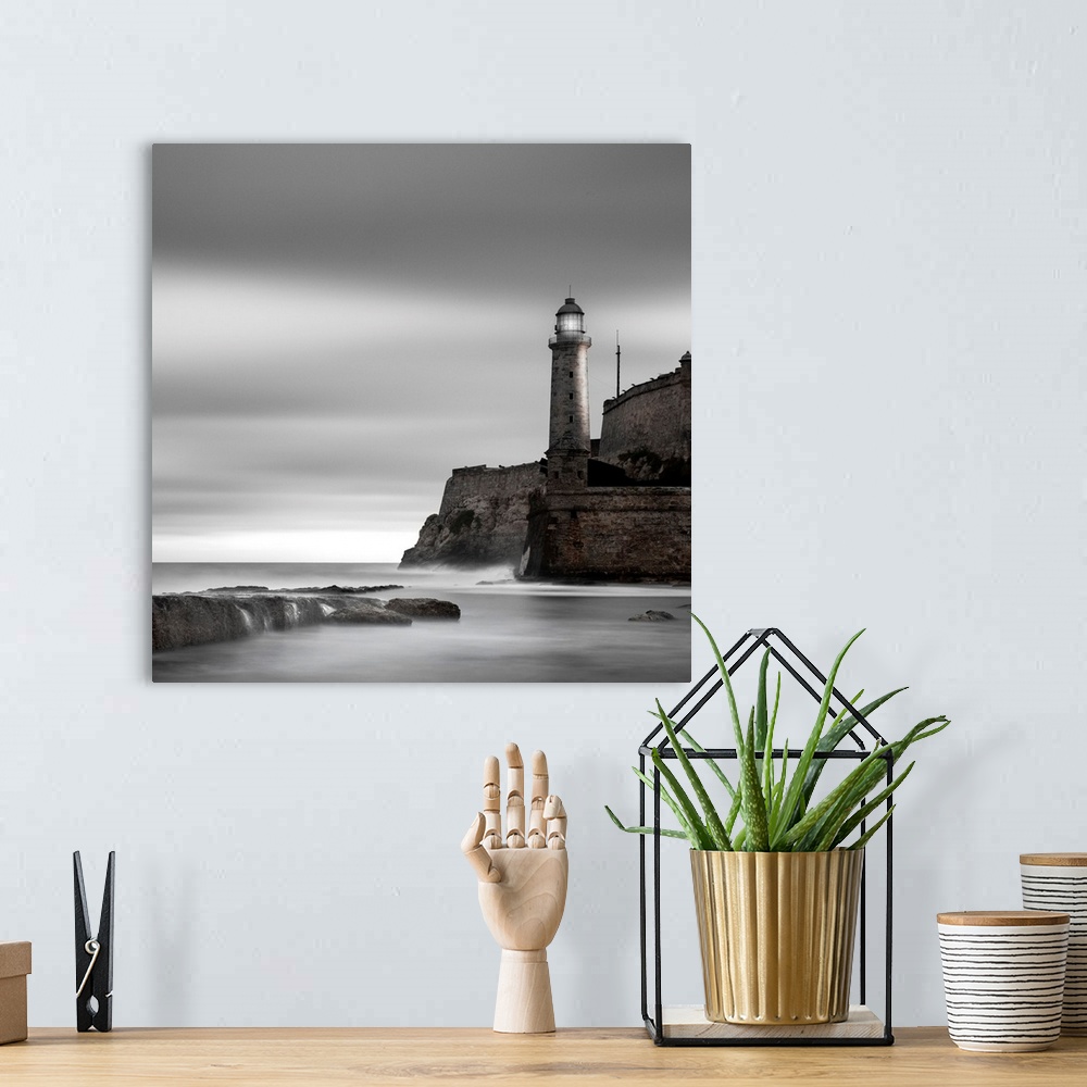 A bohemian room featuring lighthouse, cliff, fortress, ocean, seaside