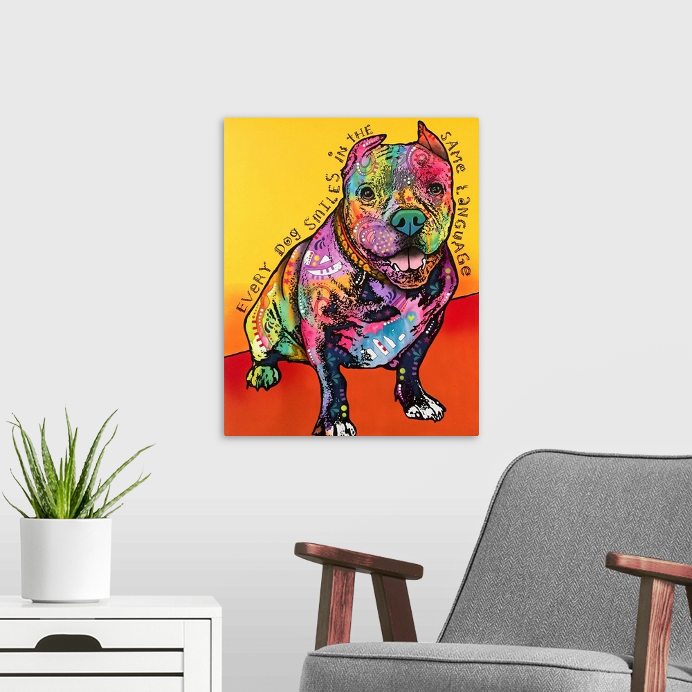A modern room featuring "Every Dog Smiles in the Same Language" handwritten around a colorfully painted pit bull on a yel...