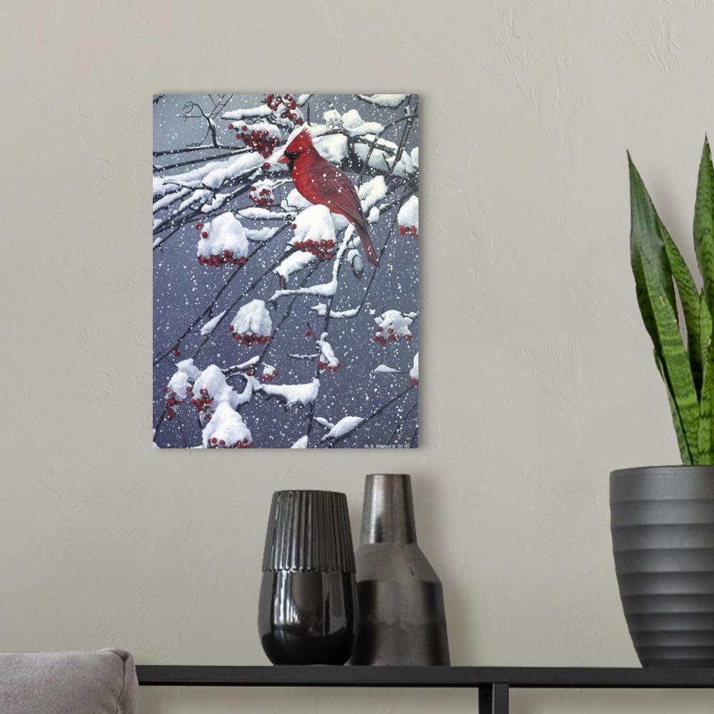 A modern room featuring A male cardinal on a snow covered tree limb.