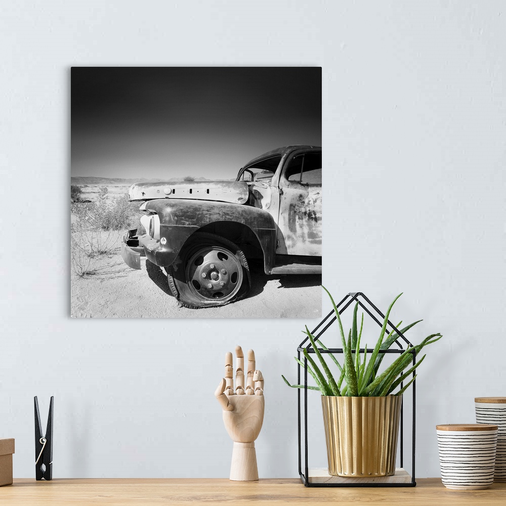 A bohemian room featuring Namibia Rotten Car, black and white photography