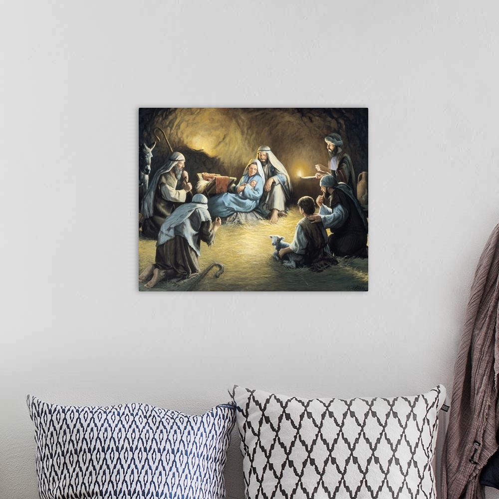A bohemian room featuring Nativity scene with people gathered around Mary and Joseph holding baby Jesus.