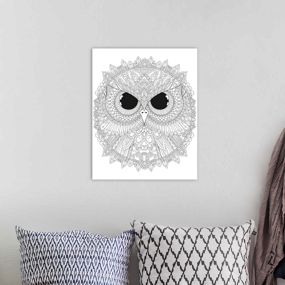 A bohemian room featuring Black and white line art of a circular design with a close-up of an owl's face with big, black, f...