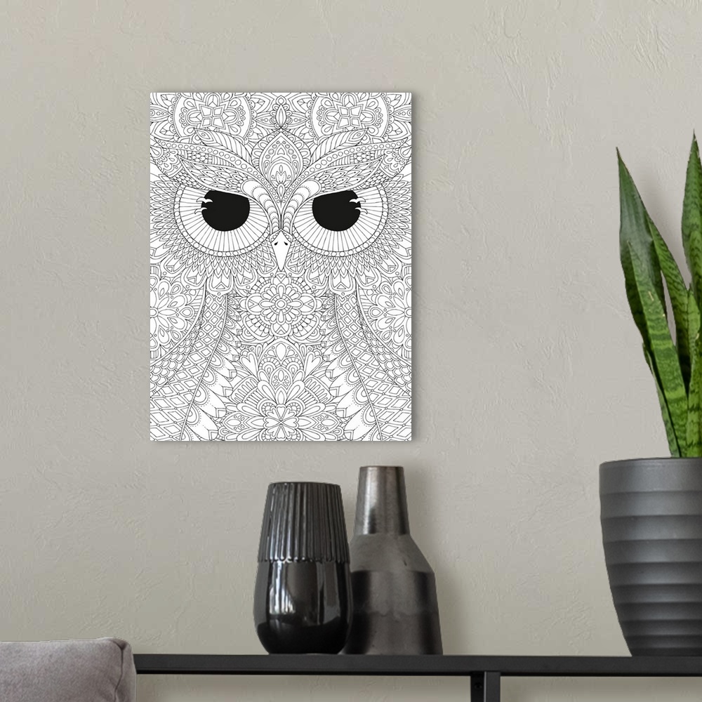 A modern room featuring Black and white line art of a close-up owl's face with big, black, fierce eyes.