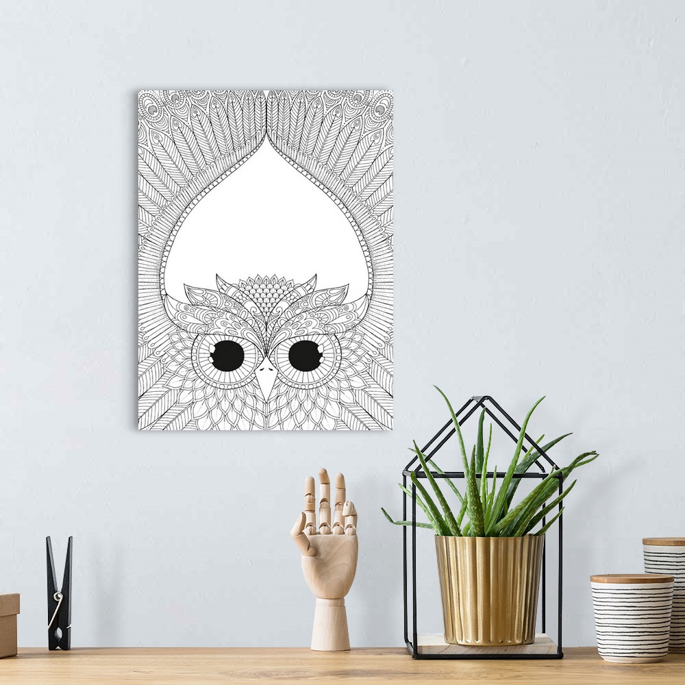 A bohemian room featuring Black and white line art of an intricately designed owl spreading its wings above its head.