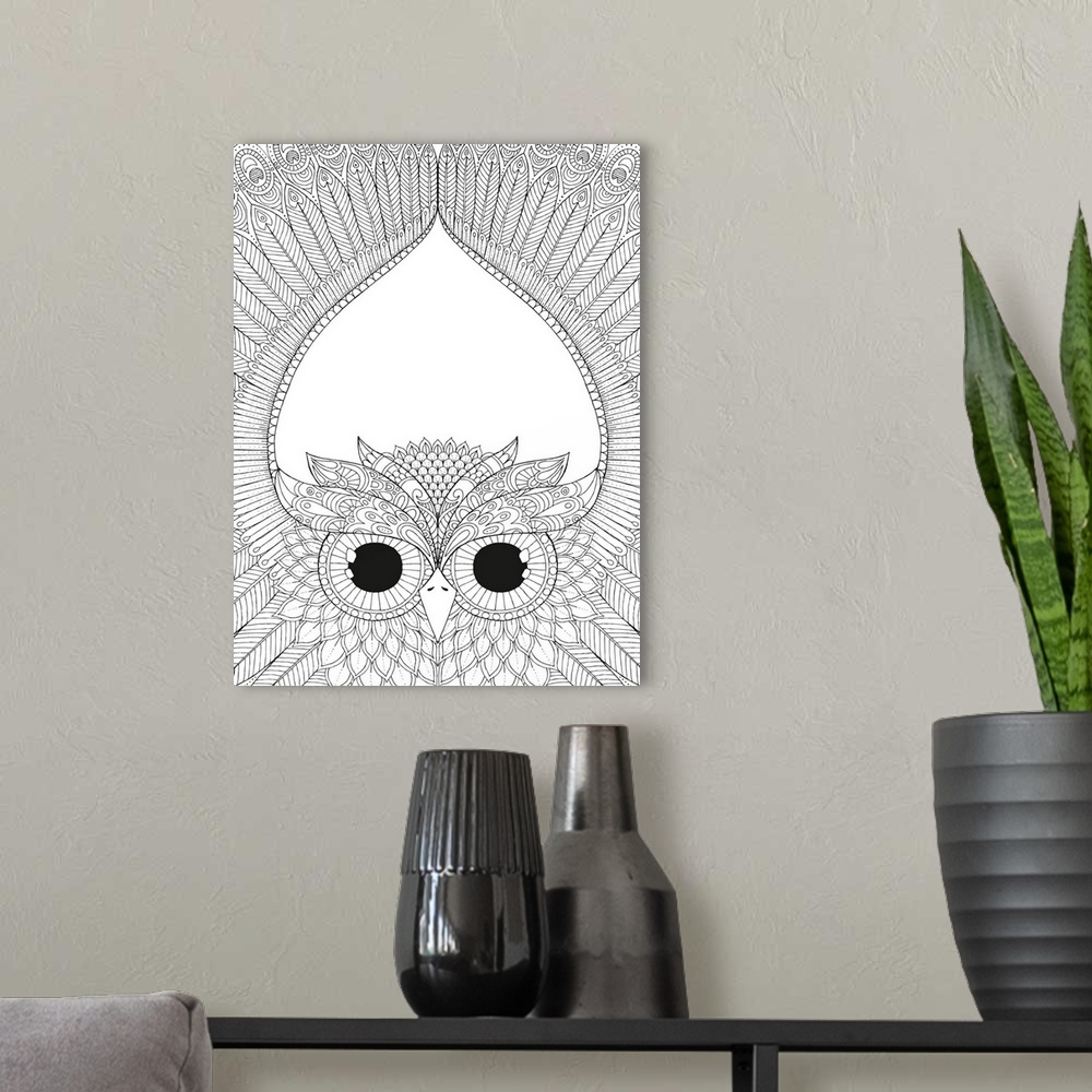 A modern room featuring Black and white line art of an intricately designed owl spreading its wings above its head.