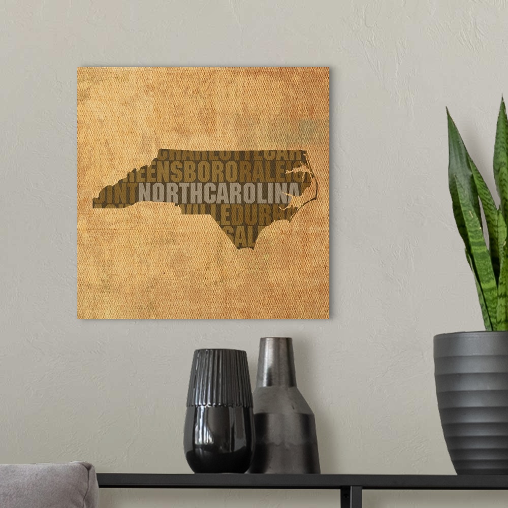A modern room featuring Contemporary typography art map of the state outline of North Carolina.
