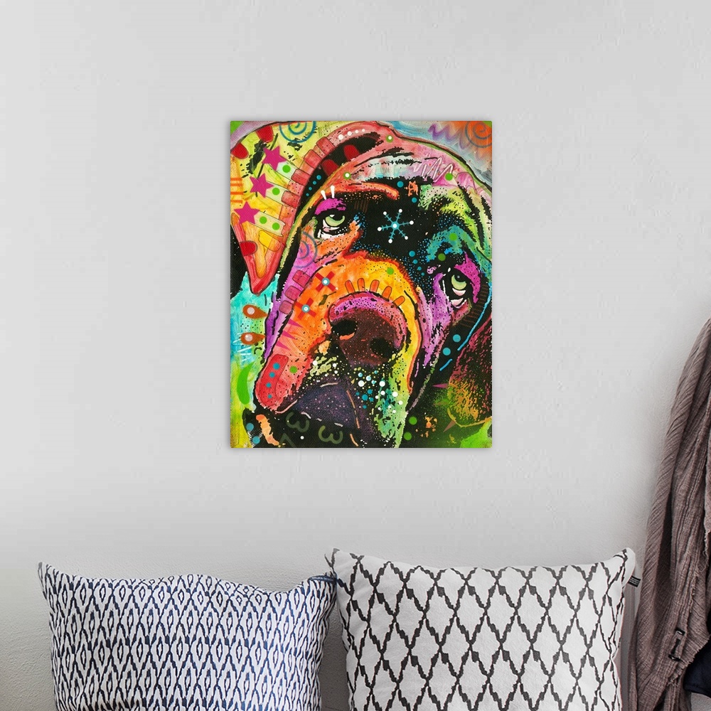 A bohemian room featuring Vibrant painting of droopy faced dog with colorful abstract designs all over.