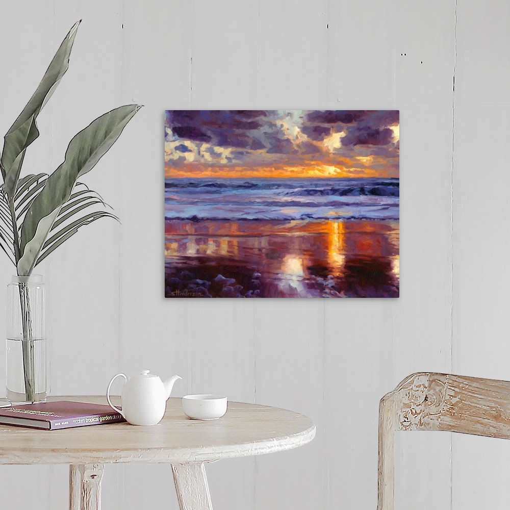 A farmhouse room featuring Abstract painting of a beach with crashing waves and a setting sun in the distance made up of big...