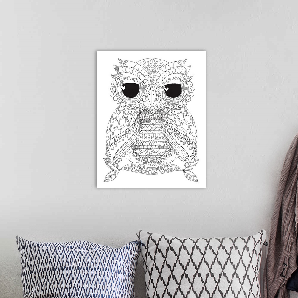 A bohemian room featuring Black and white line art of an owl with unique markings and big black eyes with heart shaped pupils.