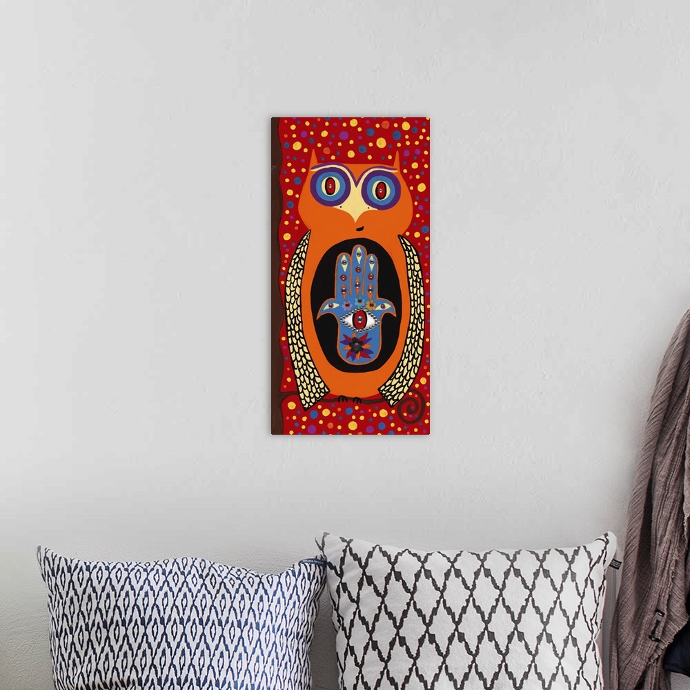 A bohemian room featuring Painting of an orange owl with a hamsa symbol and wide open eyes.