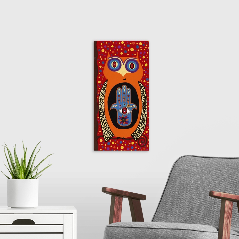 A modern room featuring Painting of an orange owl with a hamsa symbol and wide open eyes.