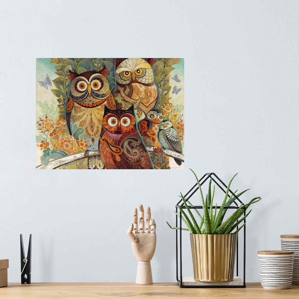A bohemian room featuring Illustration of several owls in colorful paisley patterns.