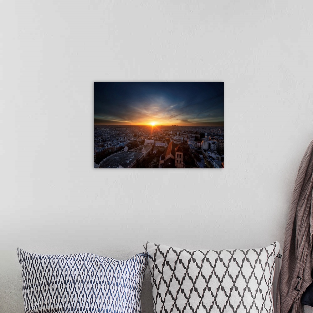 A bohemian room featuring A photograph of Paris at Sunset.