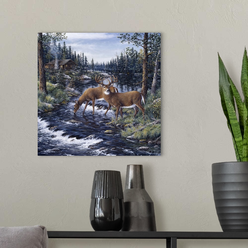 A modern room featuring 2 deer drinking from a mountain stream
