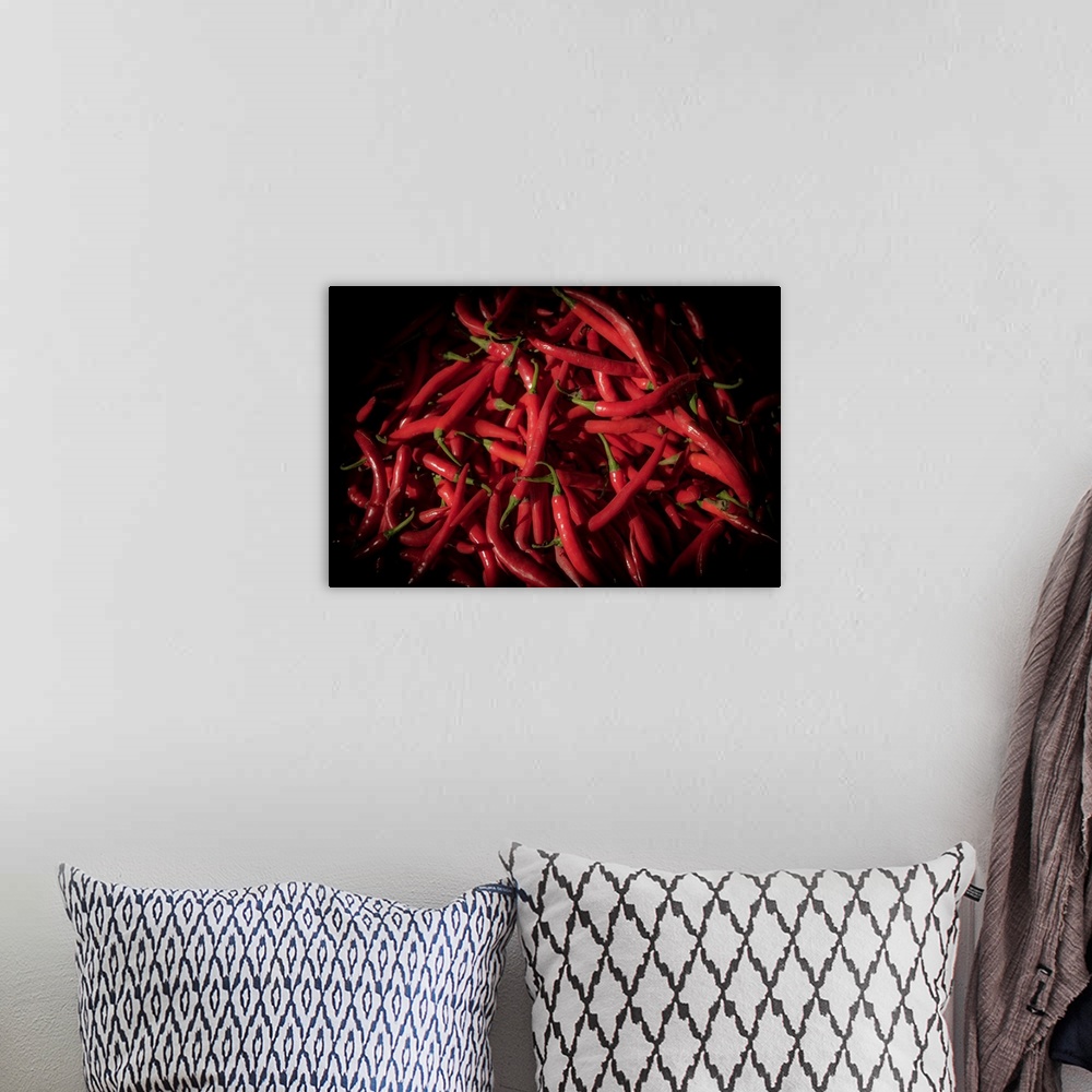 A bohemian room featuring Photograph of red cayenne peppers with a black vignette.