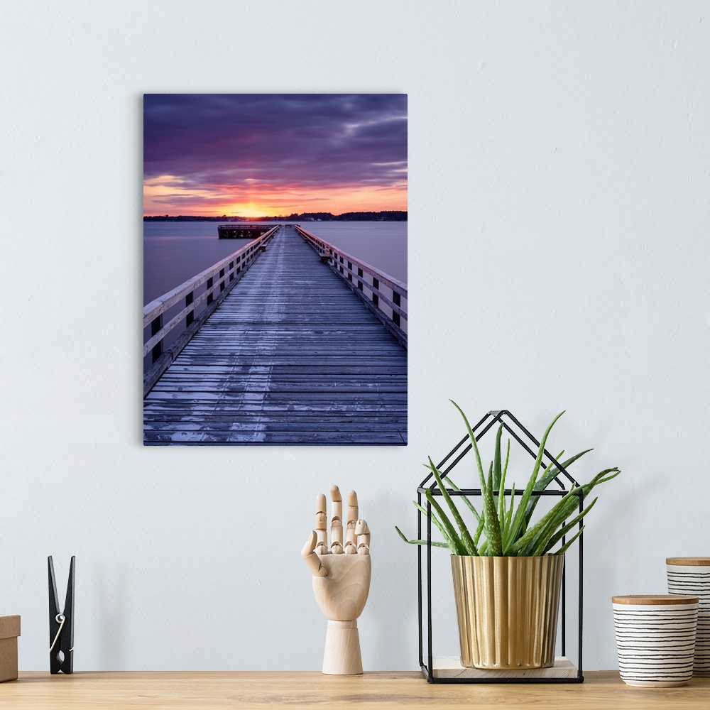 A bohemian room featuring Photograph of a long, wooden pier at Fort Foster, Maine, with a pink and purple sunrise.