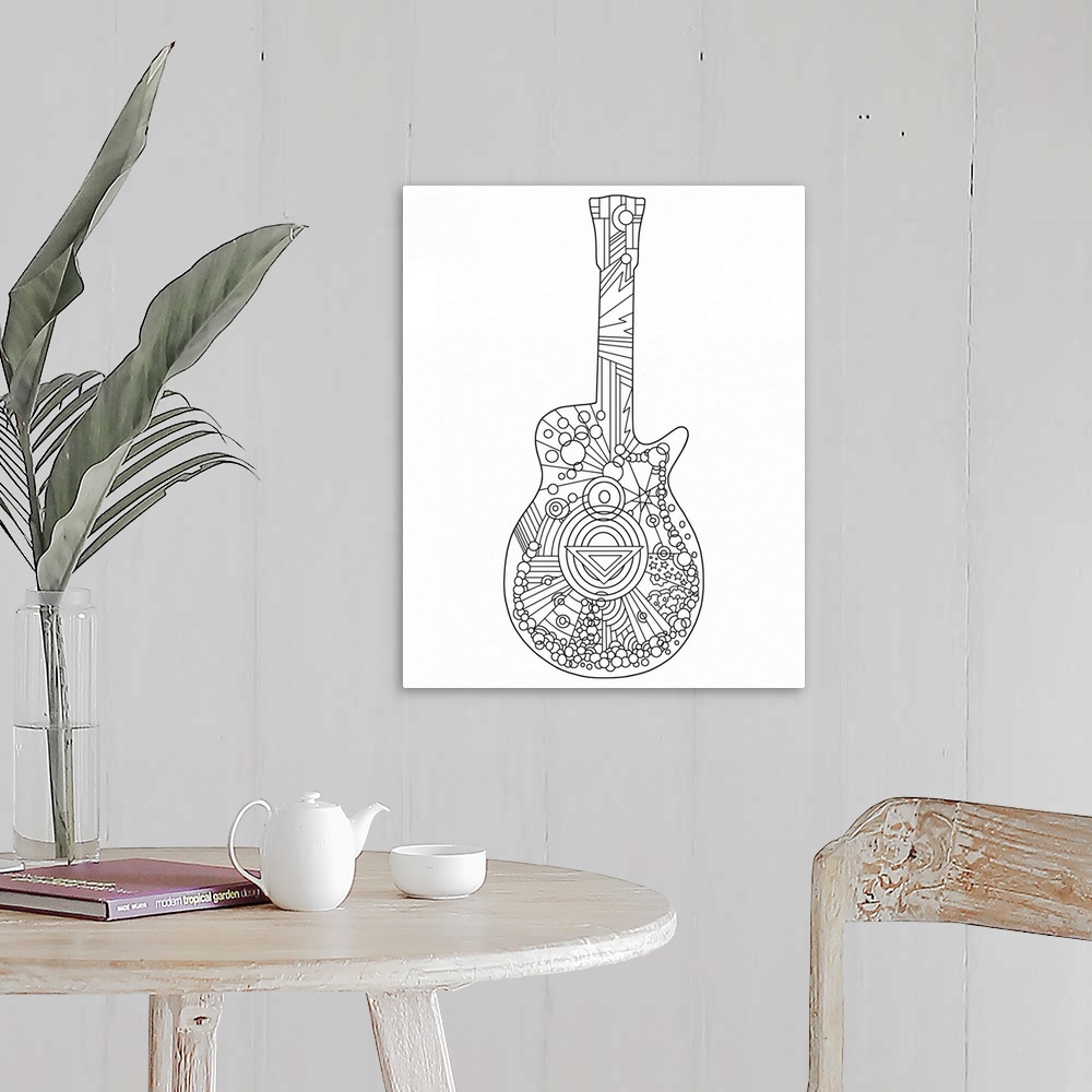 A farmhouse room featuring Black and white line art of a guitar.