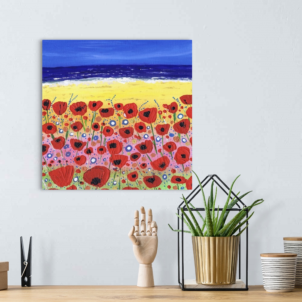 A bohemian room featuring A painting of wildflowers on the beach.