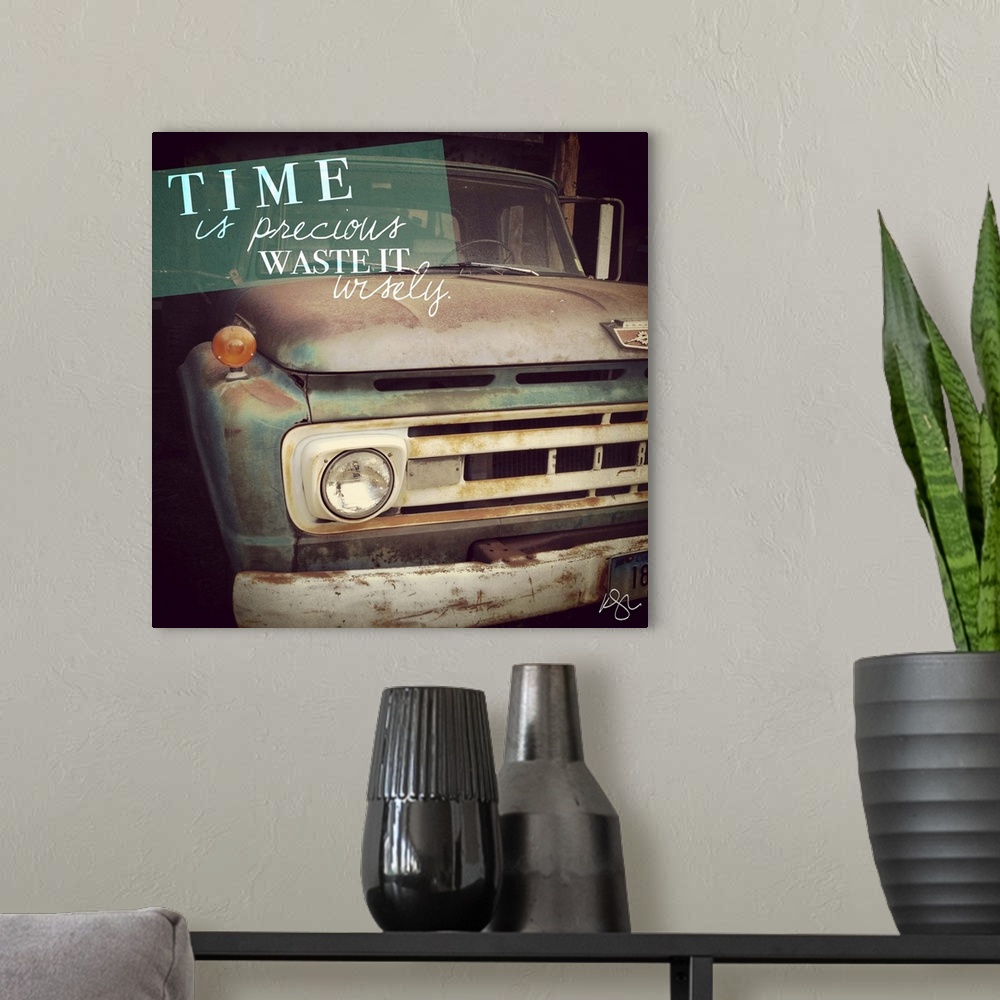A modern room featuring Motivational text against background photograph of a old beat up truck.