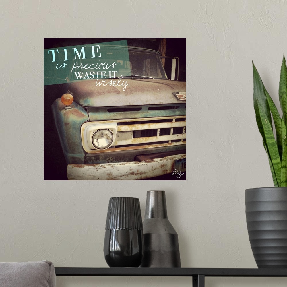 A modern room featuring Motivational text against background photograph of a old beat up truck.