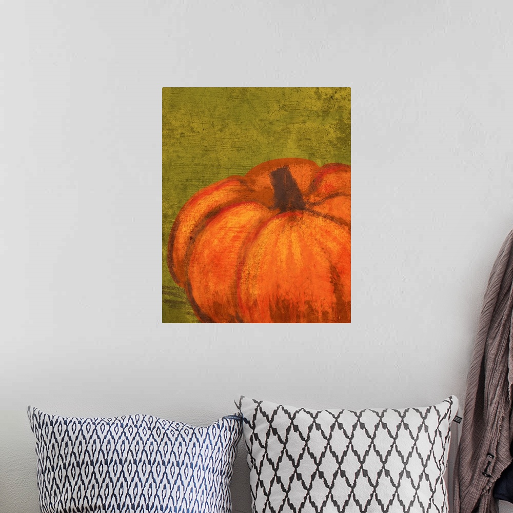 A bohemian room featuring A single pumpkin on a rustic green cracked background.