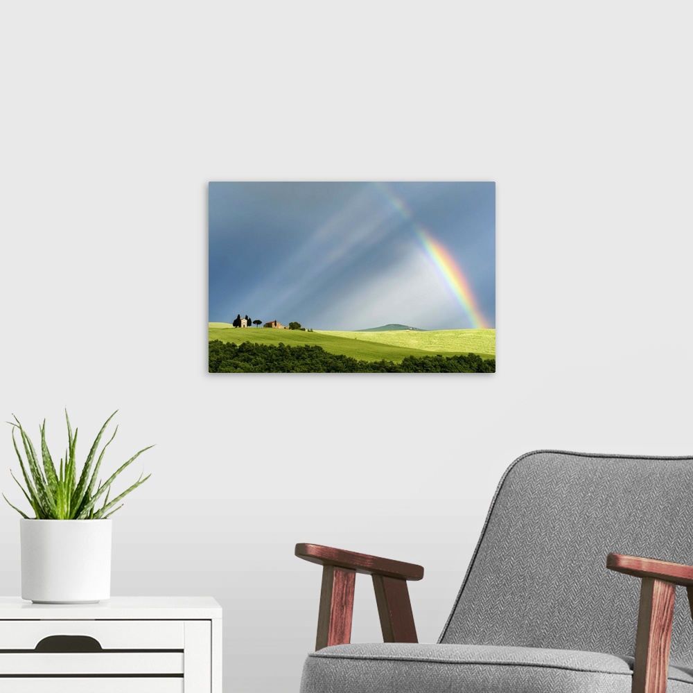 A modern room featuring A photograph of a Tuscan countryside bathed in the light streaming from a rainbow.