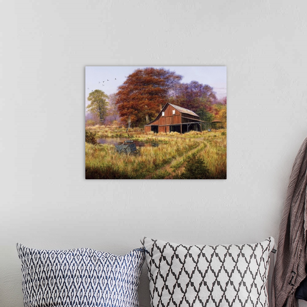 A bohemian room featuring Red barn by pond in field with geese flying south in formation aboveautumn, fall, foliage.