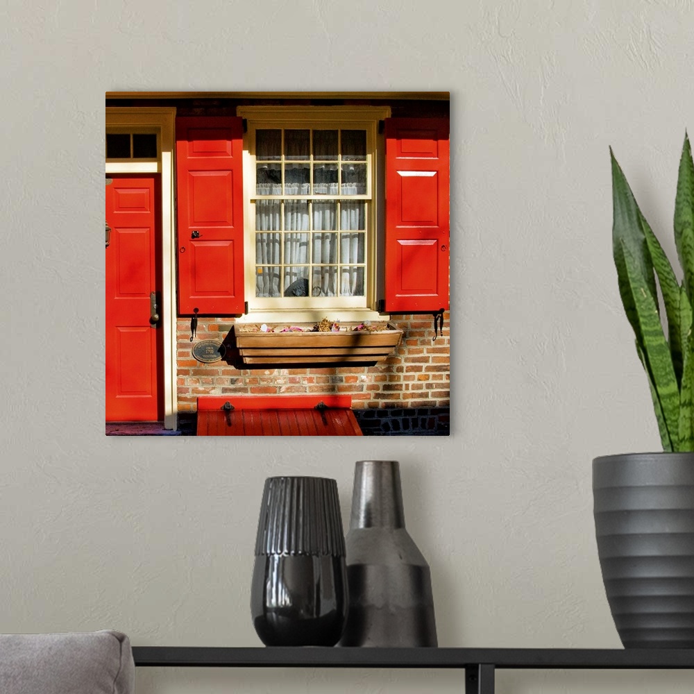 A modern room featuring Red Door, Red Shutters
