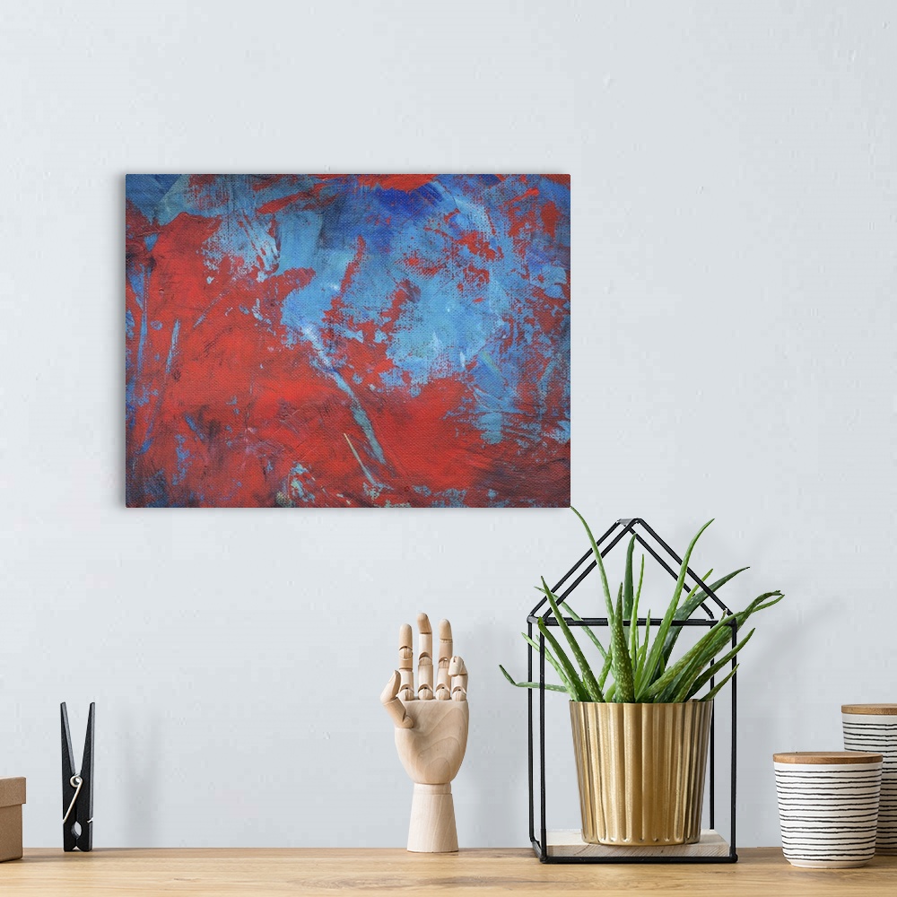 A bohemian room featuring Abstract painting with red and blue intermingling.