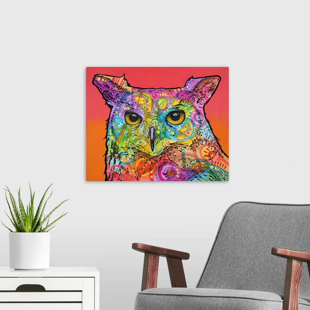 A modern room featuring Colorful painting of an owl with abstract designs on a red and orange background.