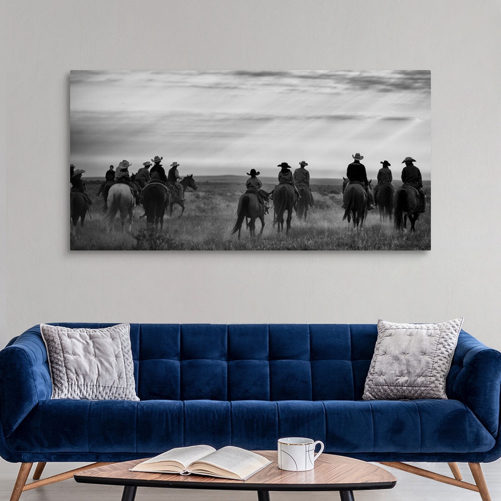 A modern room featuring group of riders in the western landscape
