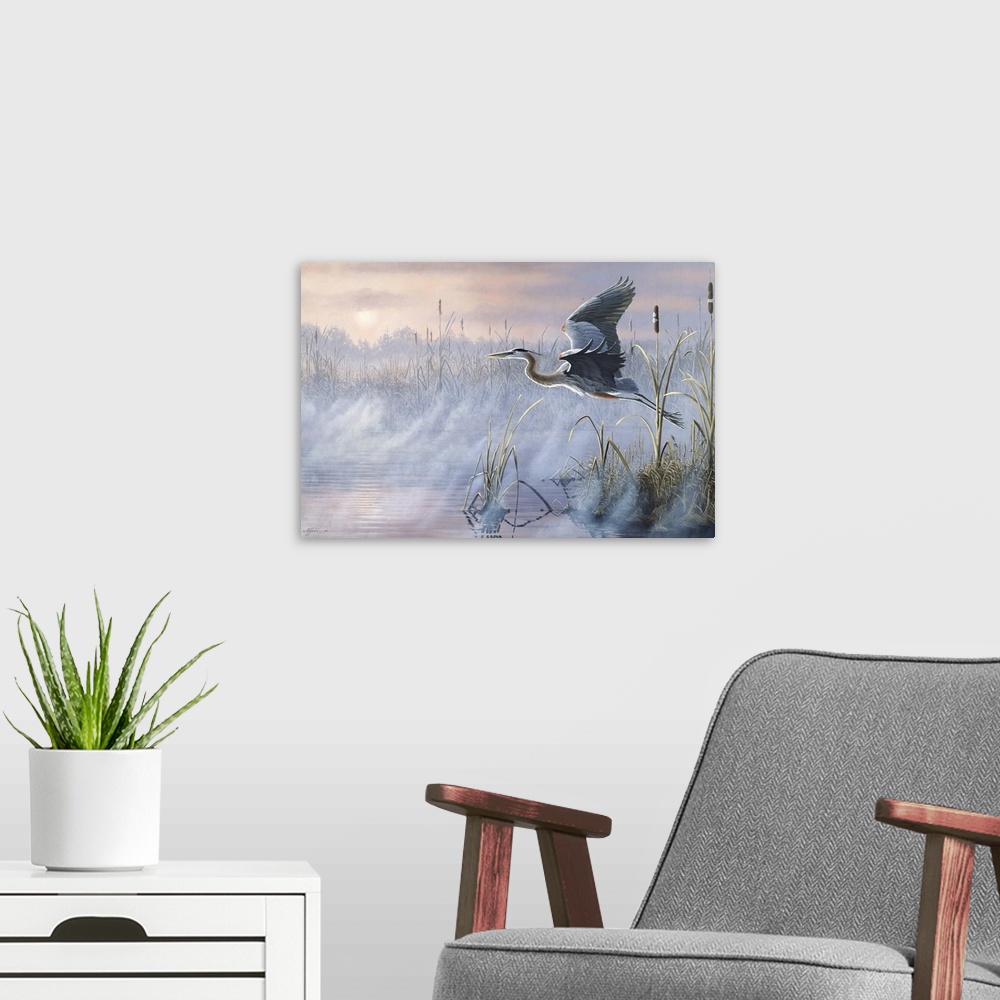 A modern room featuring Great Blue Heron flying over a misty marsh at sunrise.