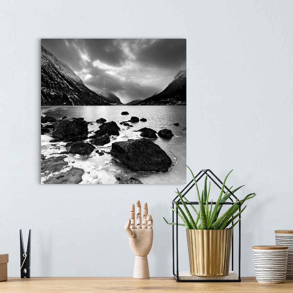 A bohemian room featuring Rocky shoreline with mountains in the distance
