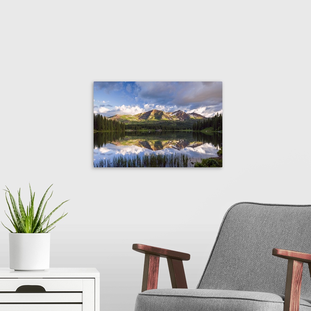 A modern room featuring A photograph of a wilderness scene.