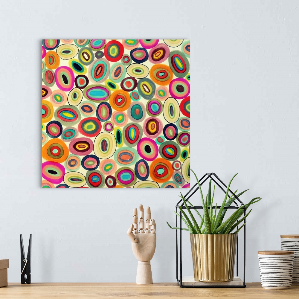 A bohemian room featuring Contemporary abstract painting using wild colors and shapes.