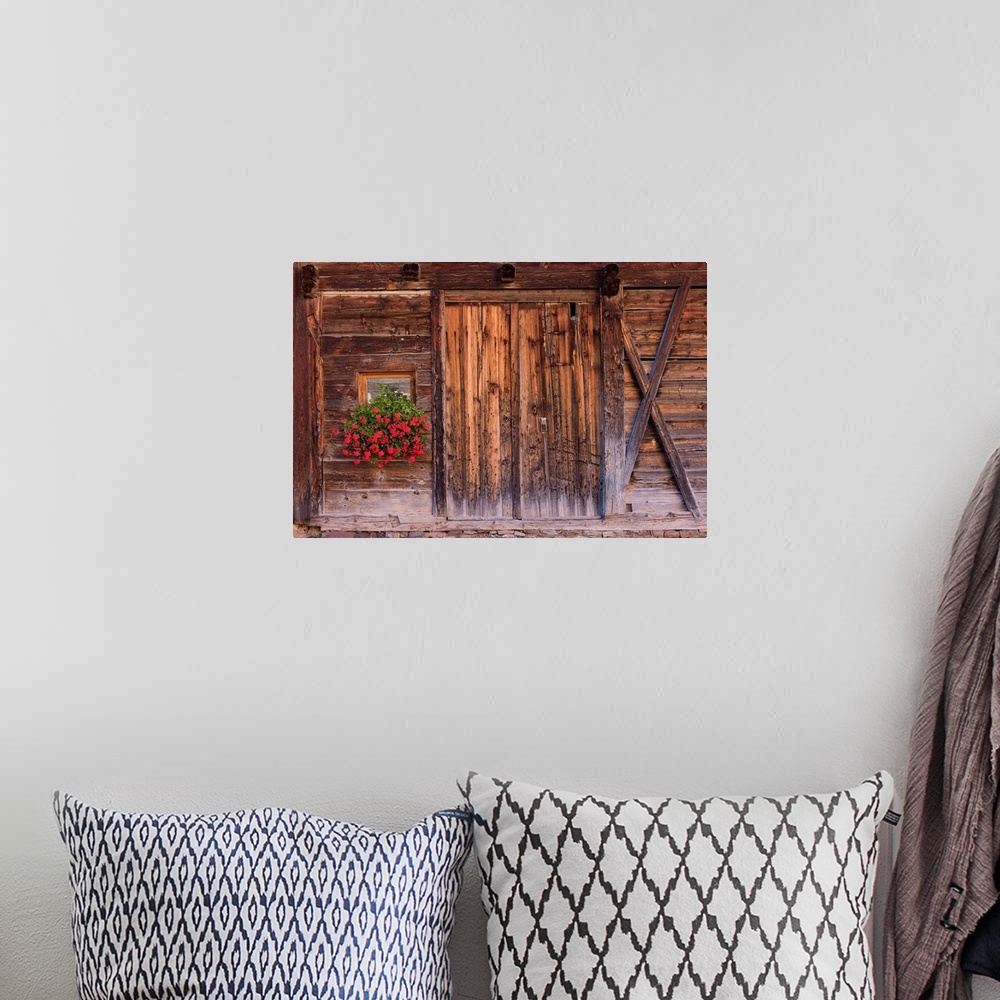 A bohemian room featuring A photograph of weathered wood on the exterior of an old barn.