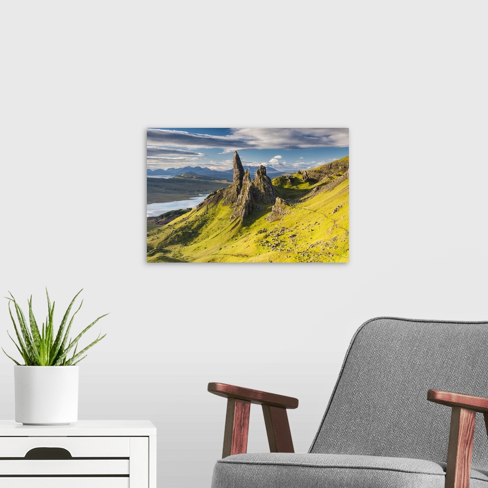 A modern room featuring A photograph of the Isle of Skye in Scotland.