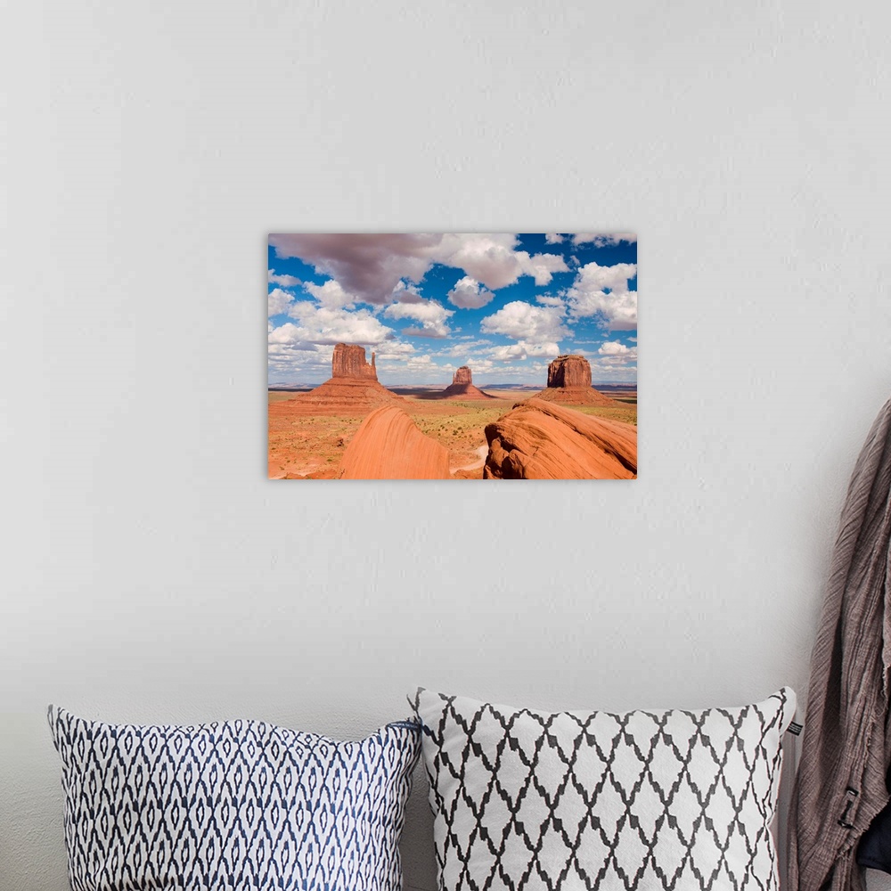 A bohemian room featuring A photograph of Monument Valley in Arizona.