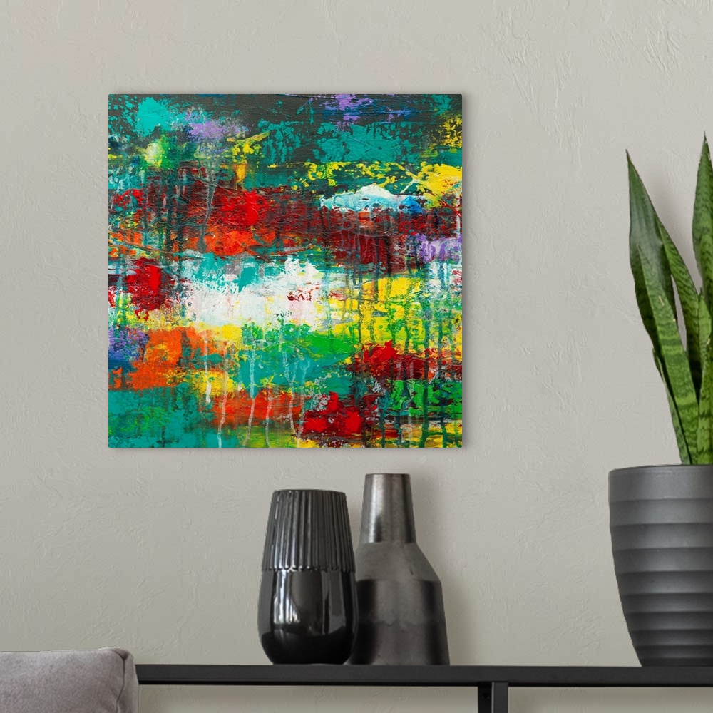 A modern room featuring Contemporary abstract in vivid rainbow colors with dripping paint.