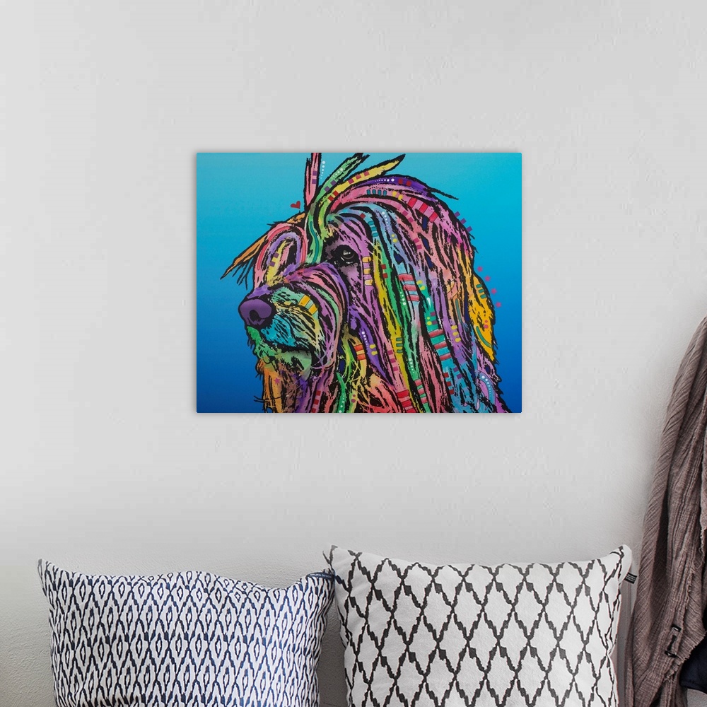 A bohemian room featuring Pop art style painting of a colorful dog with long hair and graffiti-like designs on a blue gradi...