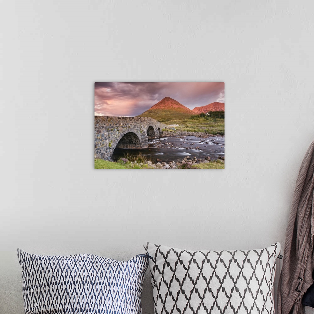 A bohemian room featuring A photograph of a Scottish landscape.
