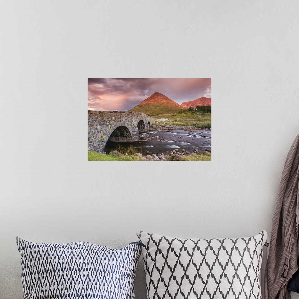 A bohemian room featuring A photograph of a Scottish landscape.