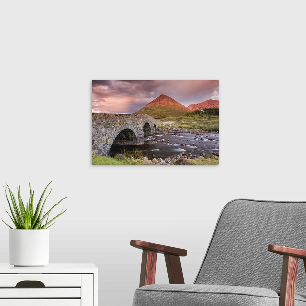 A modern room featuring A photograph of a Scottish landscape.