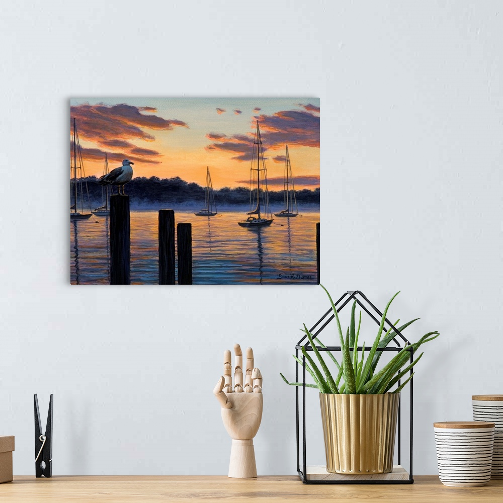 A bohemian room featuring Contemporary artwork of seagull and sailboats at sunset.
